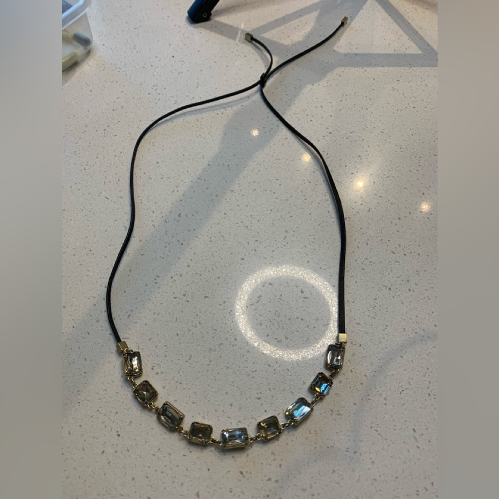 Gold beads with black slider tie
